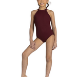 A young girl with her hair in a bun modeling a sleeveless, high-neck burgundy leotard against a solid white background.