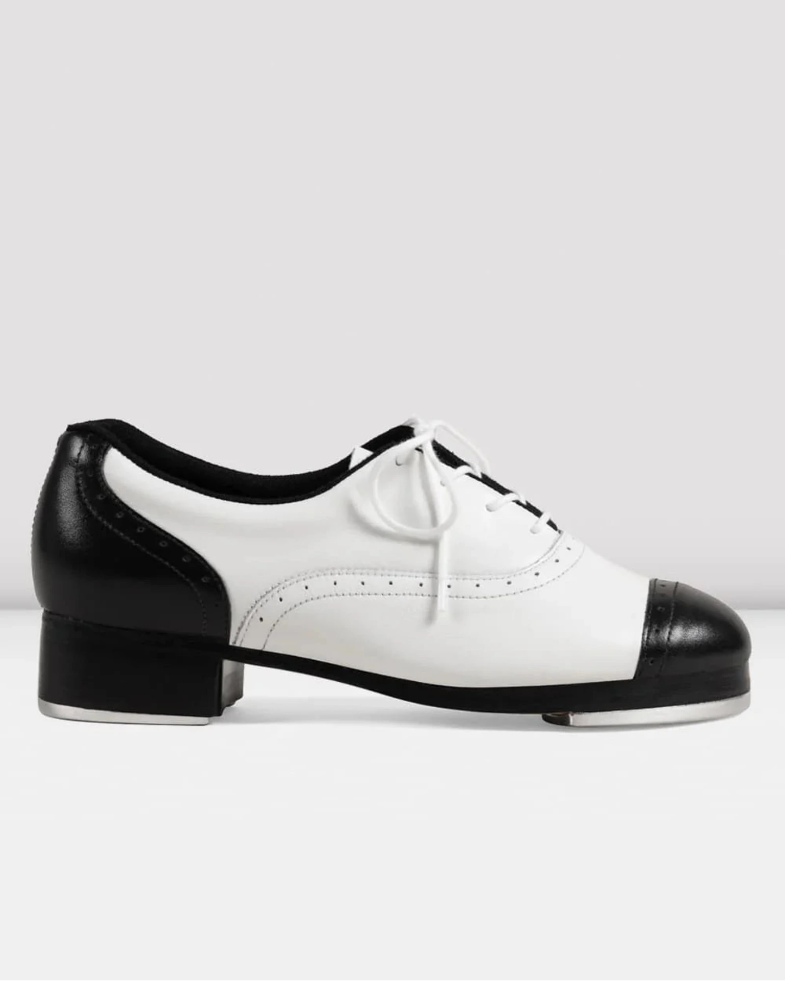 Black and white tap dance shoe on a light gray background