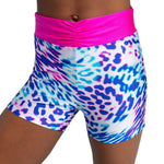 Multicolored animal print shorts with pink waistband on a white background