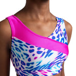 Multicolored dance crop bra top with pink accents on a model against a white background