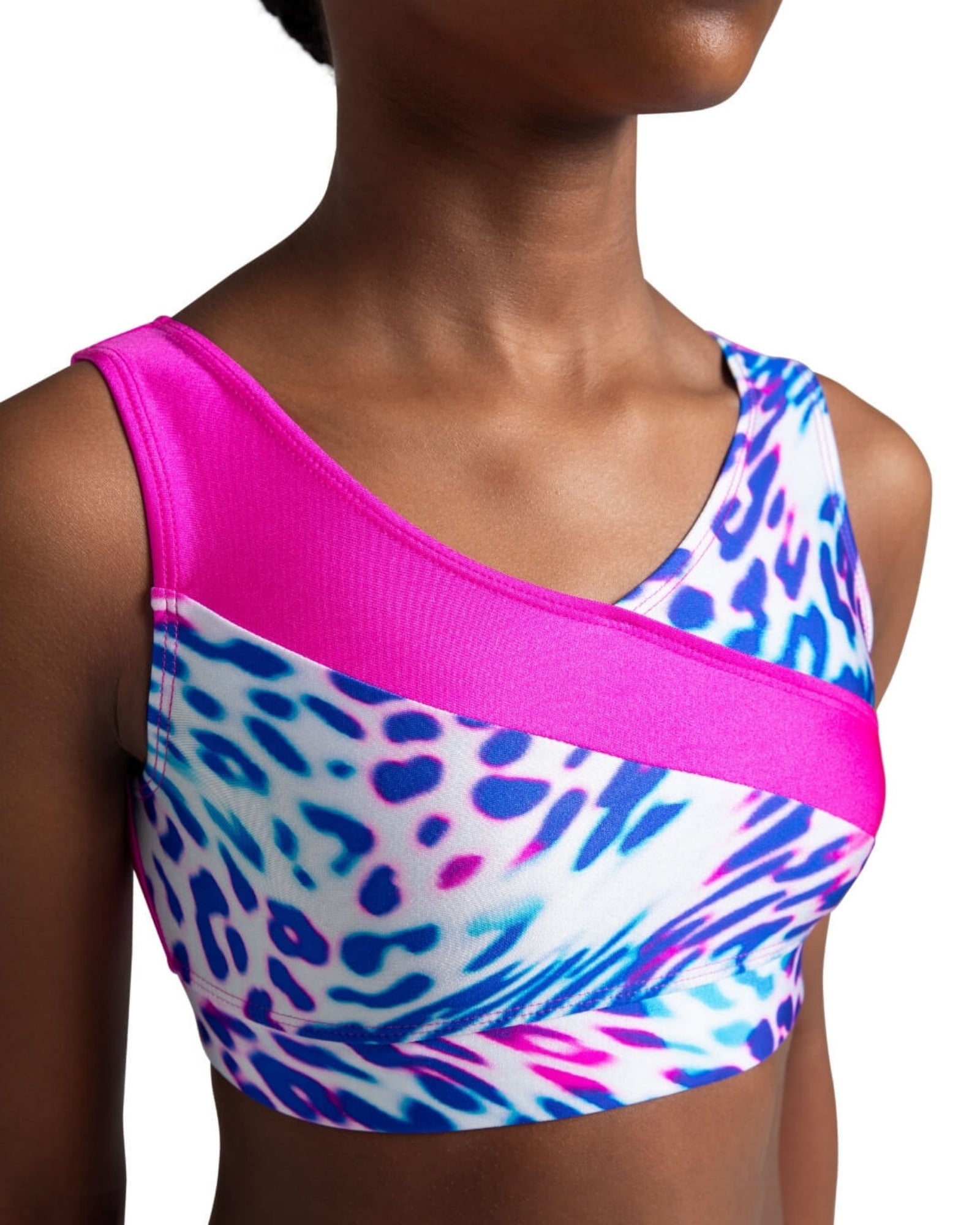 Multicolored dance crop bra top with pink accents on a model against a white background