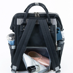 Black backpack with compartments containing a phone, bottle, and other items on a white background