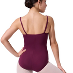 Woman wearing a burgundy leotard on a white background