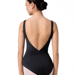 Black leotard with open back worn by a dancer on a white background