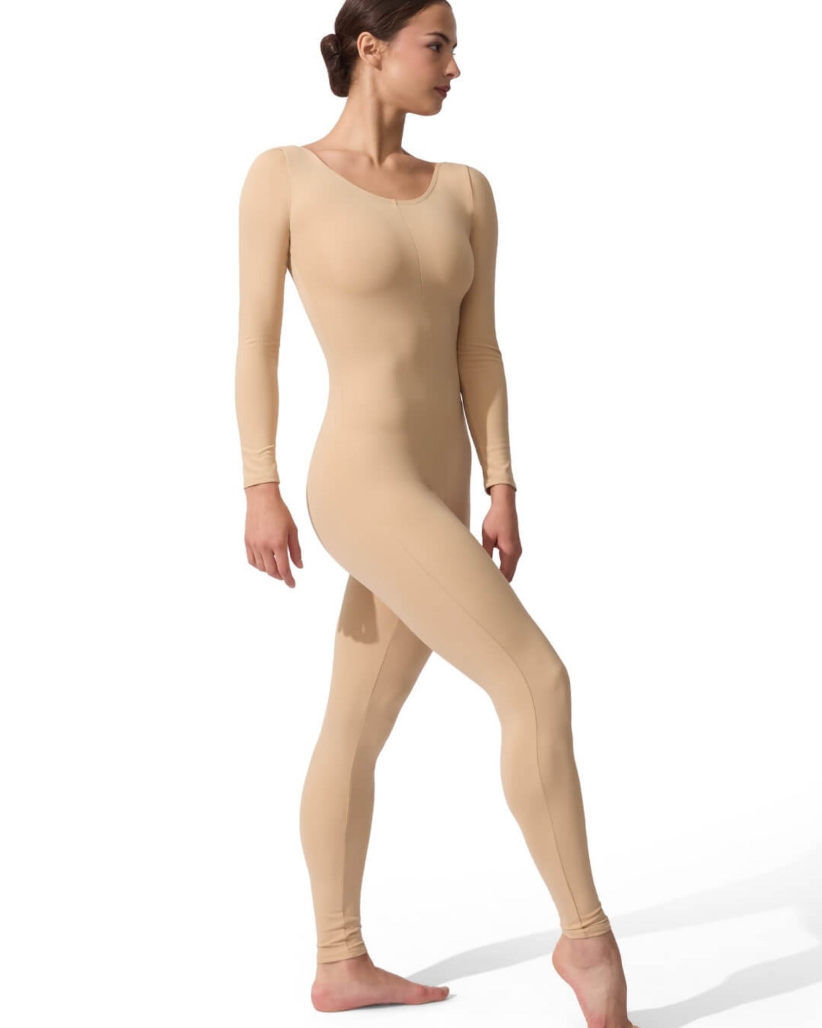 Woman wearing a beige bodysuit on a white background