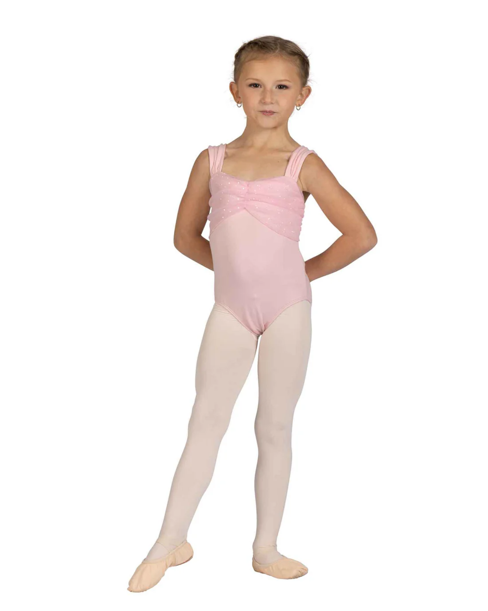 Young girl in a pink ballet leotard and beige tights on a white background