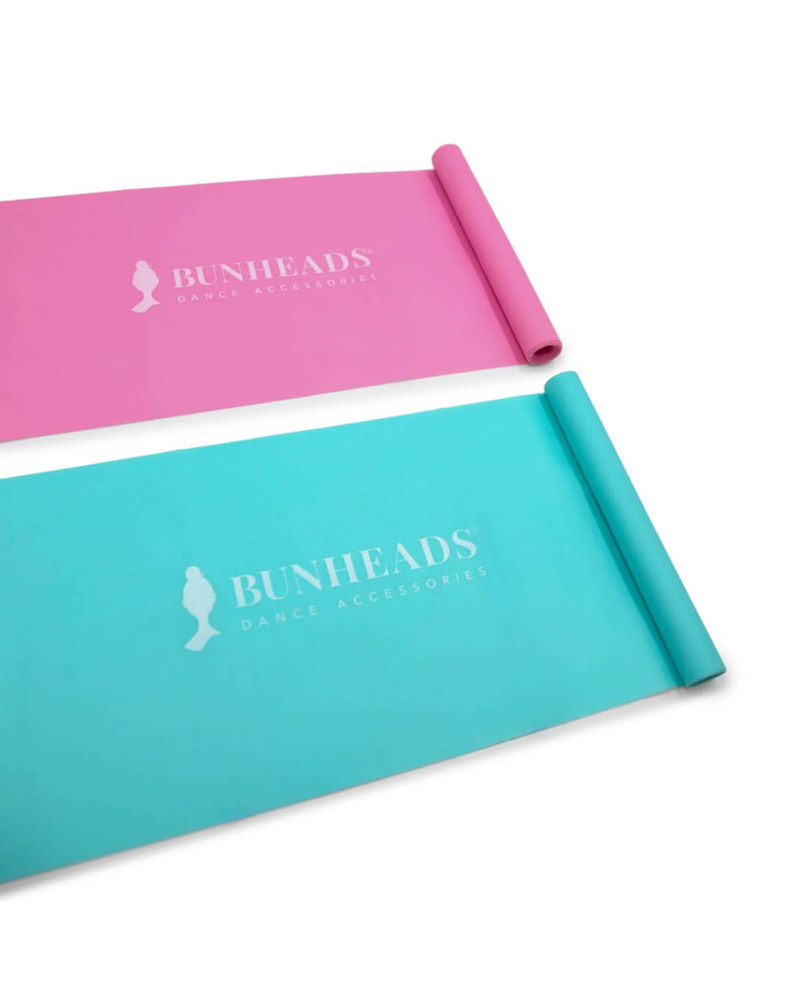 Two rolled-up exercise mats, one pink and one blue, with 'Bunheads' branding on a white background.