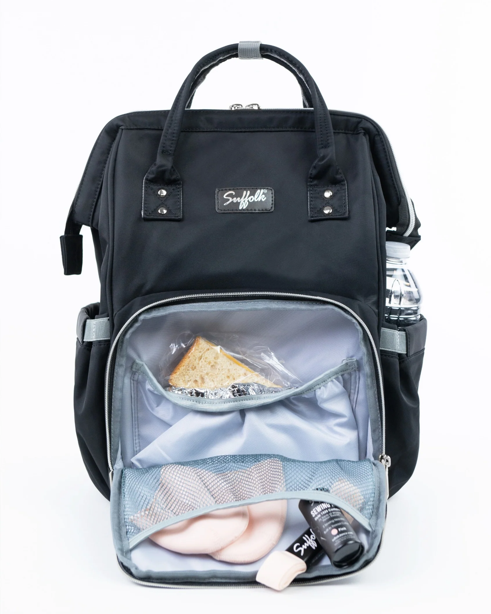 Backpack with contents on display on a plain background