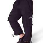 Black cargo pants worn by a person on a white background