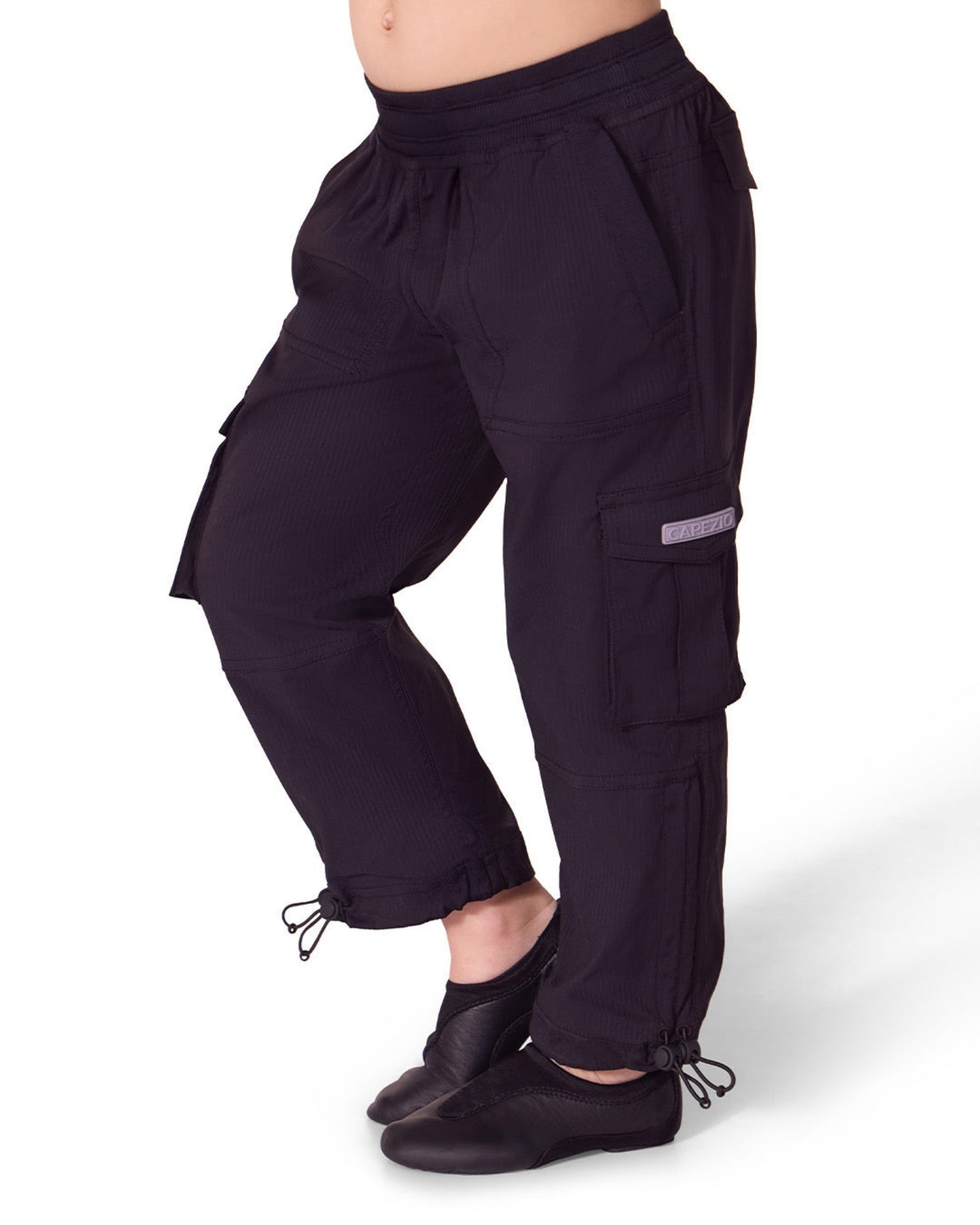 Black cargo pants worn by a person on a white background