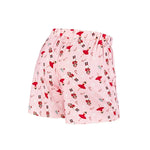 Pink pajama shorts with an all-over Christmas nutcracker and candy cane print, shown against a plain white background.