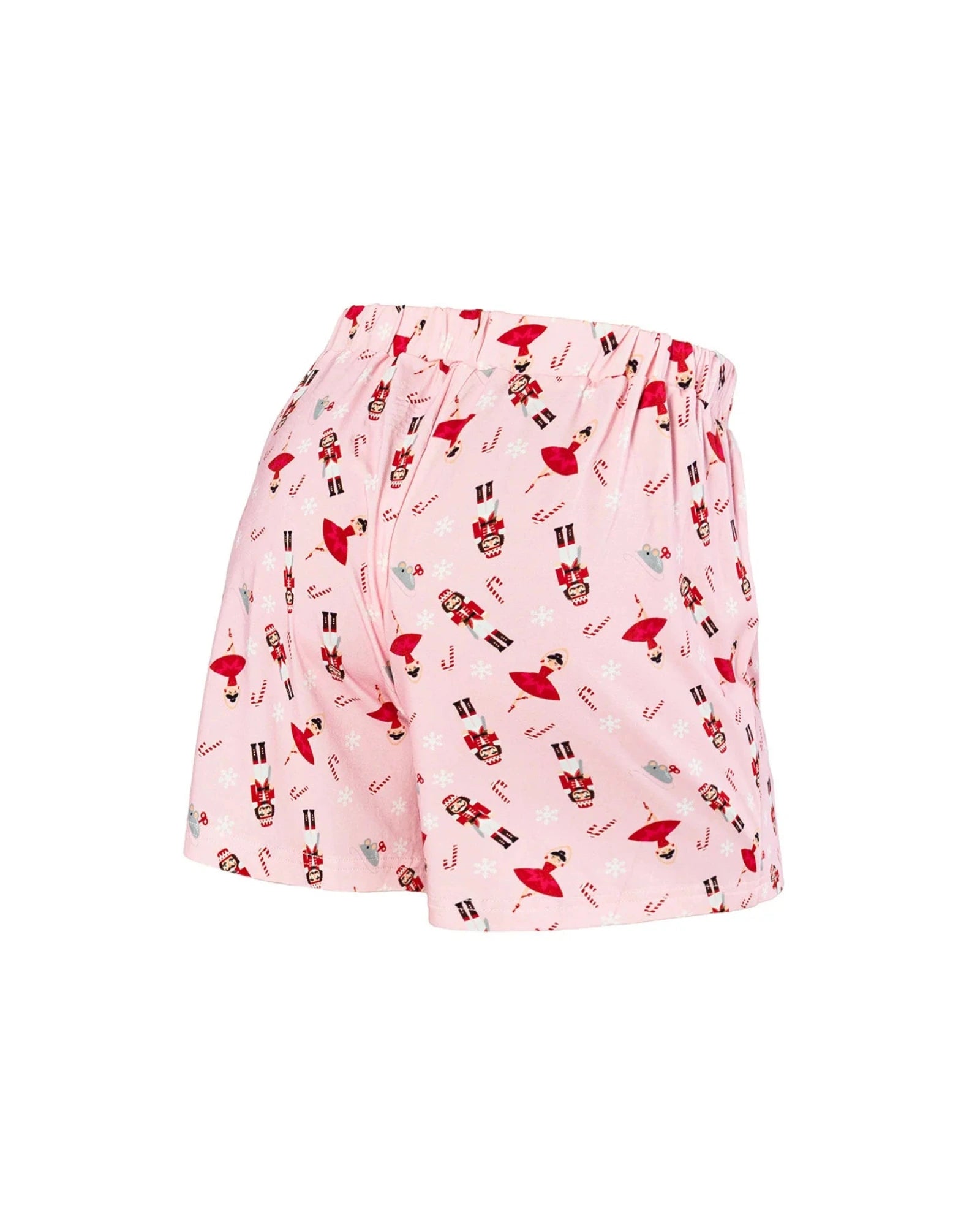 Pink pajama shorts with an all-over Christmas nutcracker and candy cane print, shown against a plain white background.