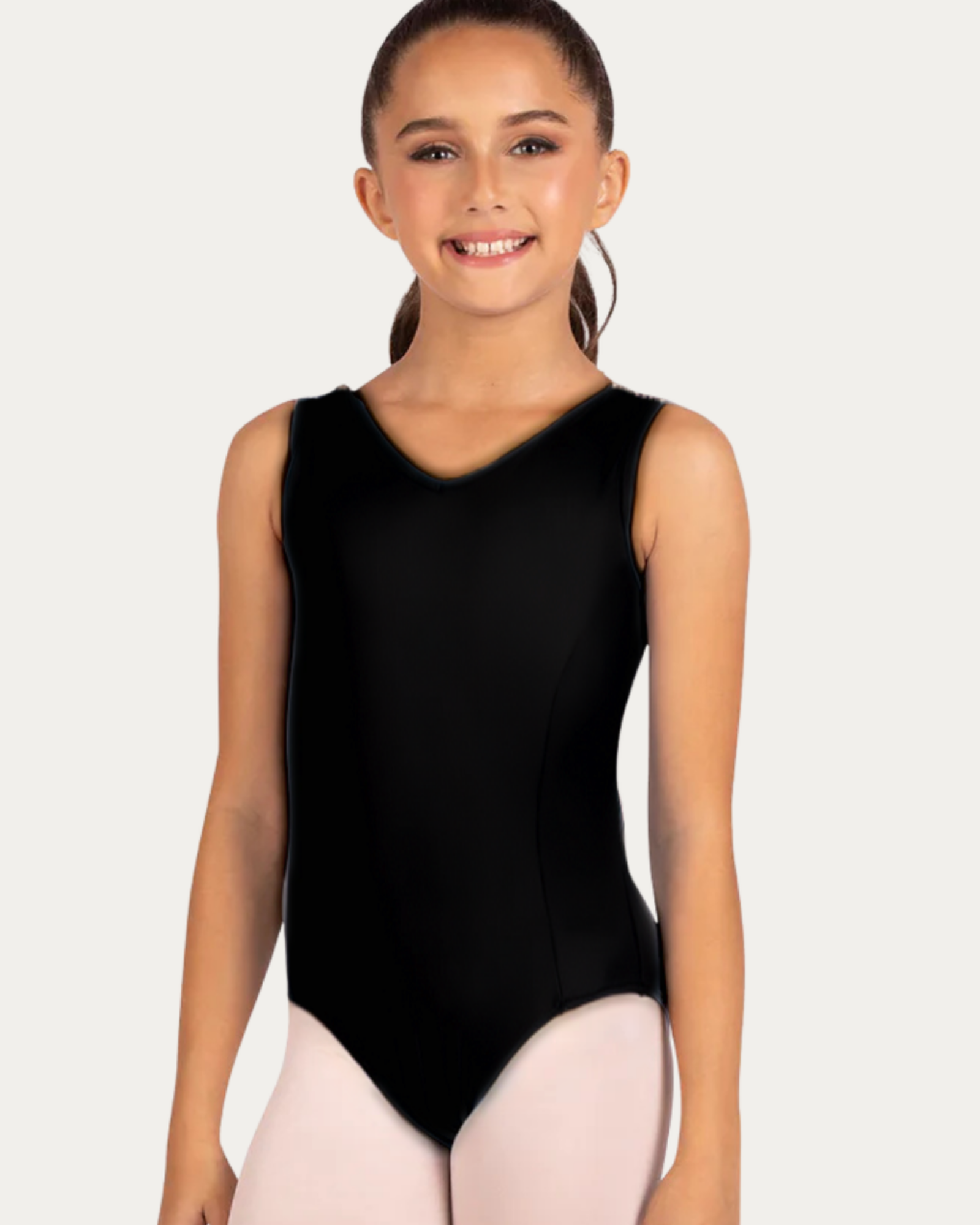 Young girl wearing a black sleeveless leotard on a white background