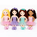 Four dolls with different hair colors and outfits on a white background