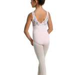 A young girl dancer shown from the back wearing a pale pink leotard with white lace detailing on the back and light pink tights, standing on a white background.