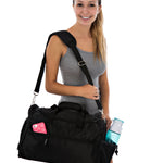 Woman holding a black duffel bag with a water bottle on a white background