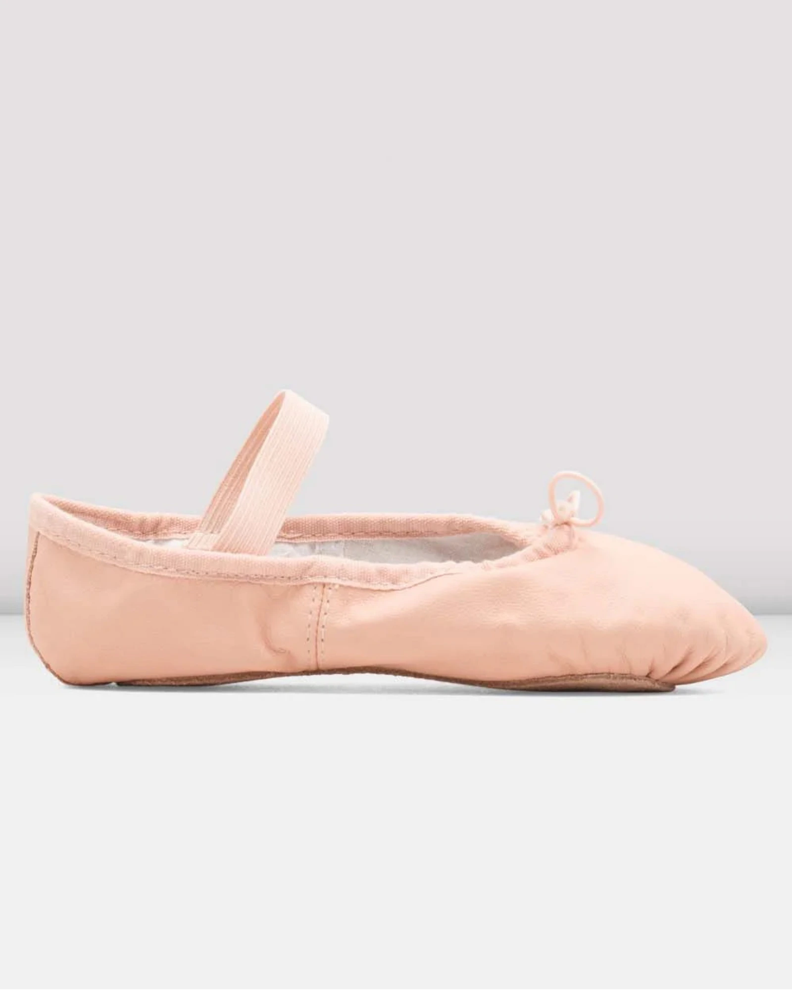 Pink ballet shoe on a light gray background