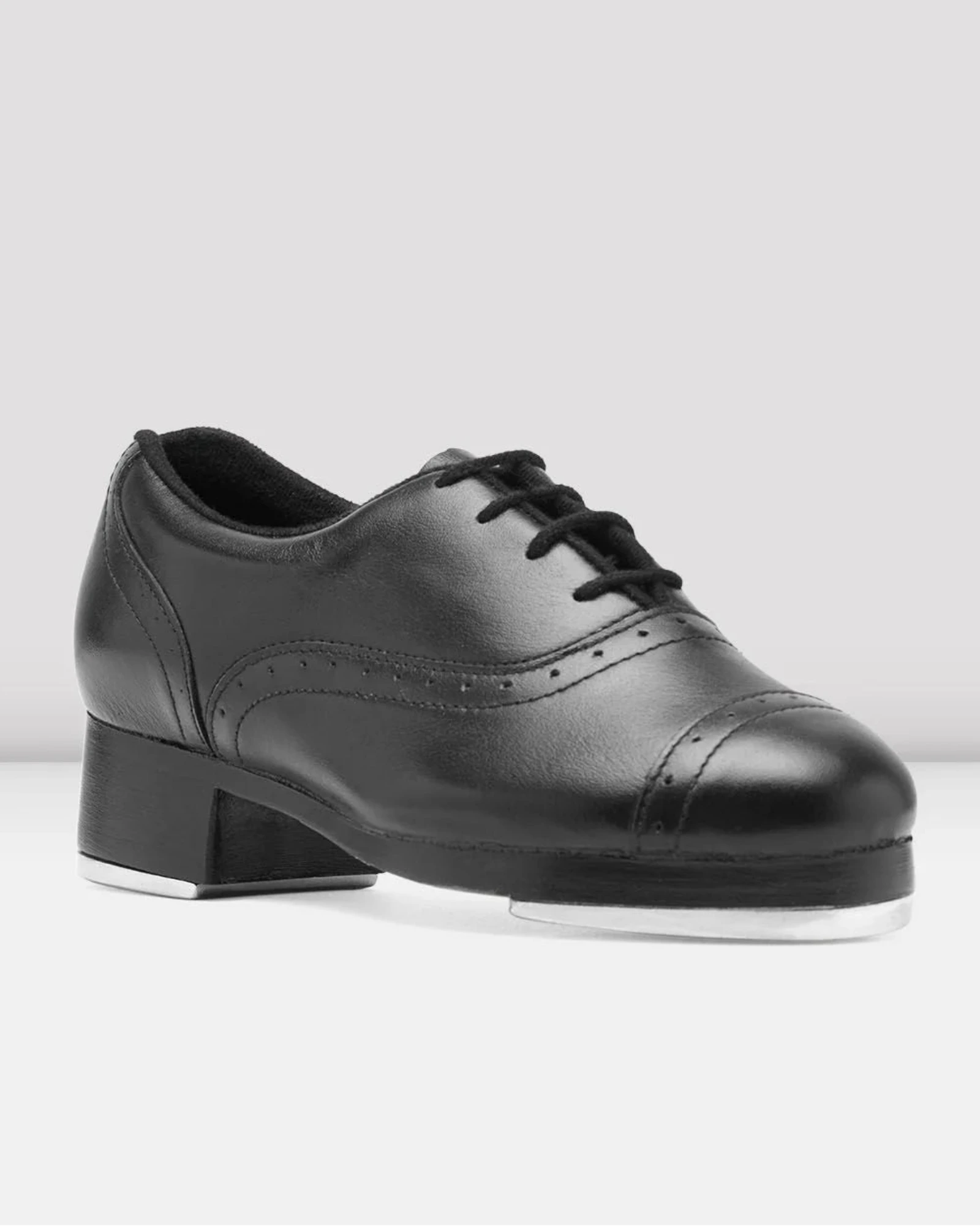 Black tap dance shoe on a white background