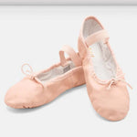Pair of pink ballet shoes on a light gray background
