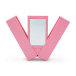 Pink compact mirror with a white background