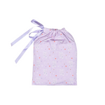 A light purple drawstring pouch with a ballet-themed print of white ballet slippers and small red hearts, finished with a matching purple ribbon tie.