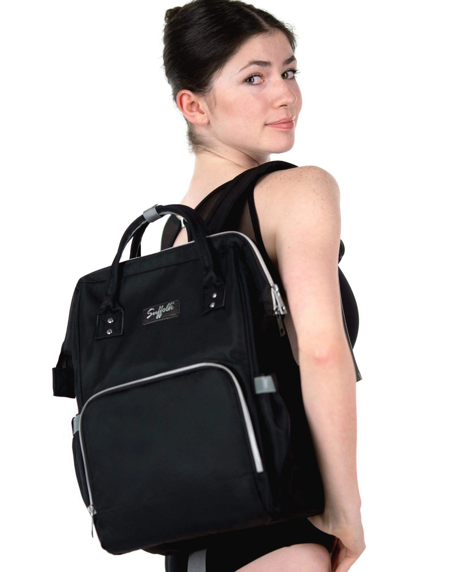 Woman wearing a black backpack with visible branding on a white background