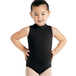 Young girl wearing a black leotard on a white background