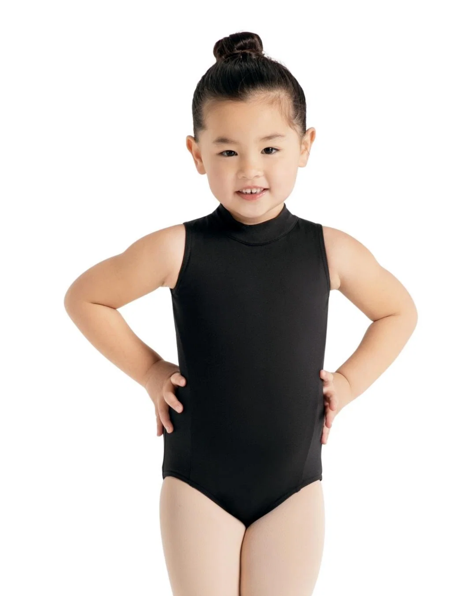 Young girl wearing a black leotard on a white background