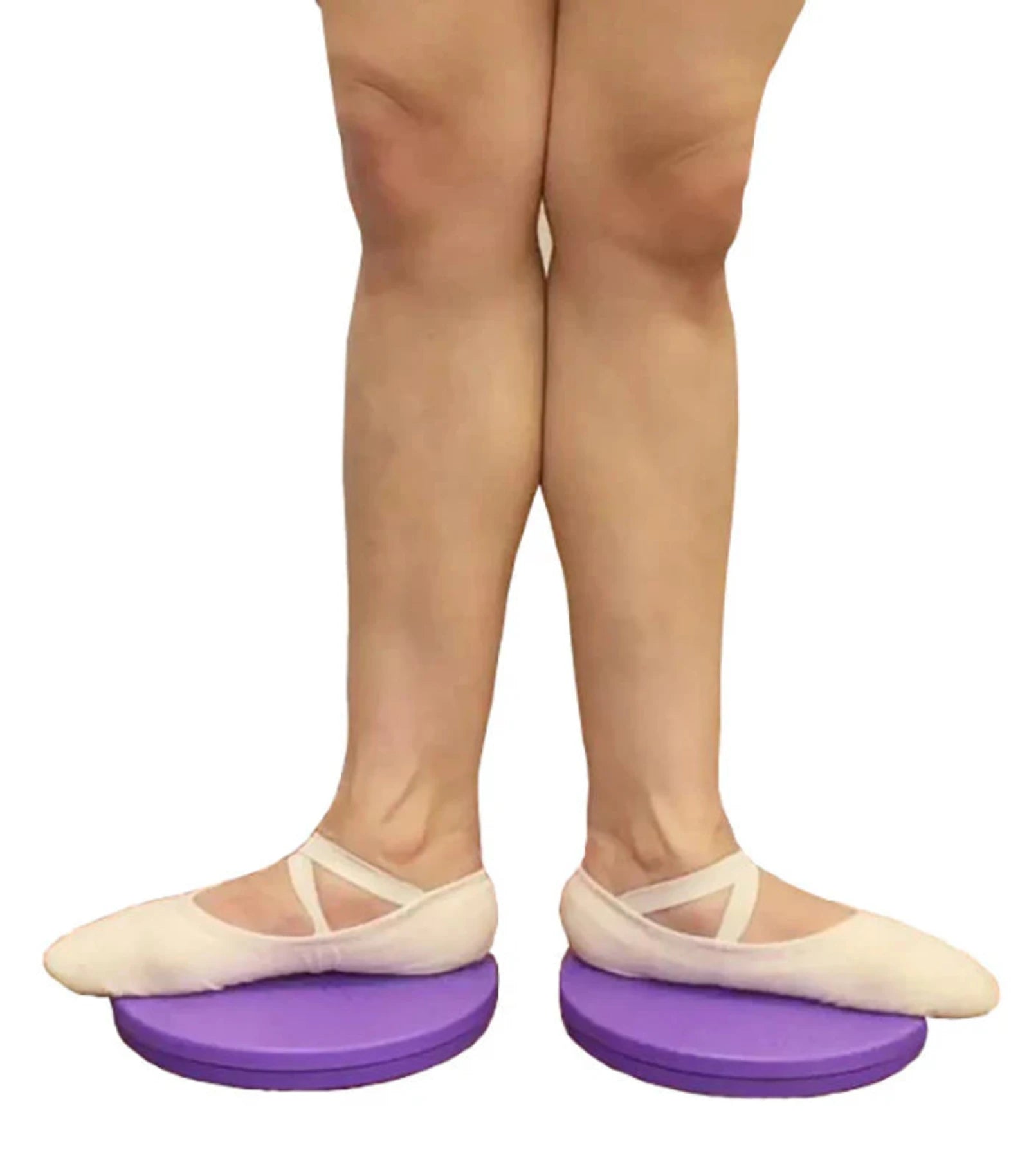 Person wearing ballet shoes on purple balance disks with a white background