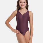 Woman wearing a purple leotard on a white background