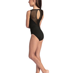 Person wearing a black leotard with mesh panels on a white background