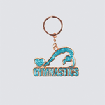 Gymnastics-themed keychain with a blue gymnast design on a light gray background