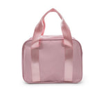 A light pink dance bag with two top handles, shown against a plain white background.