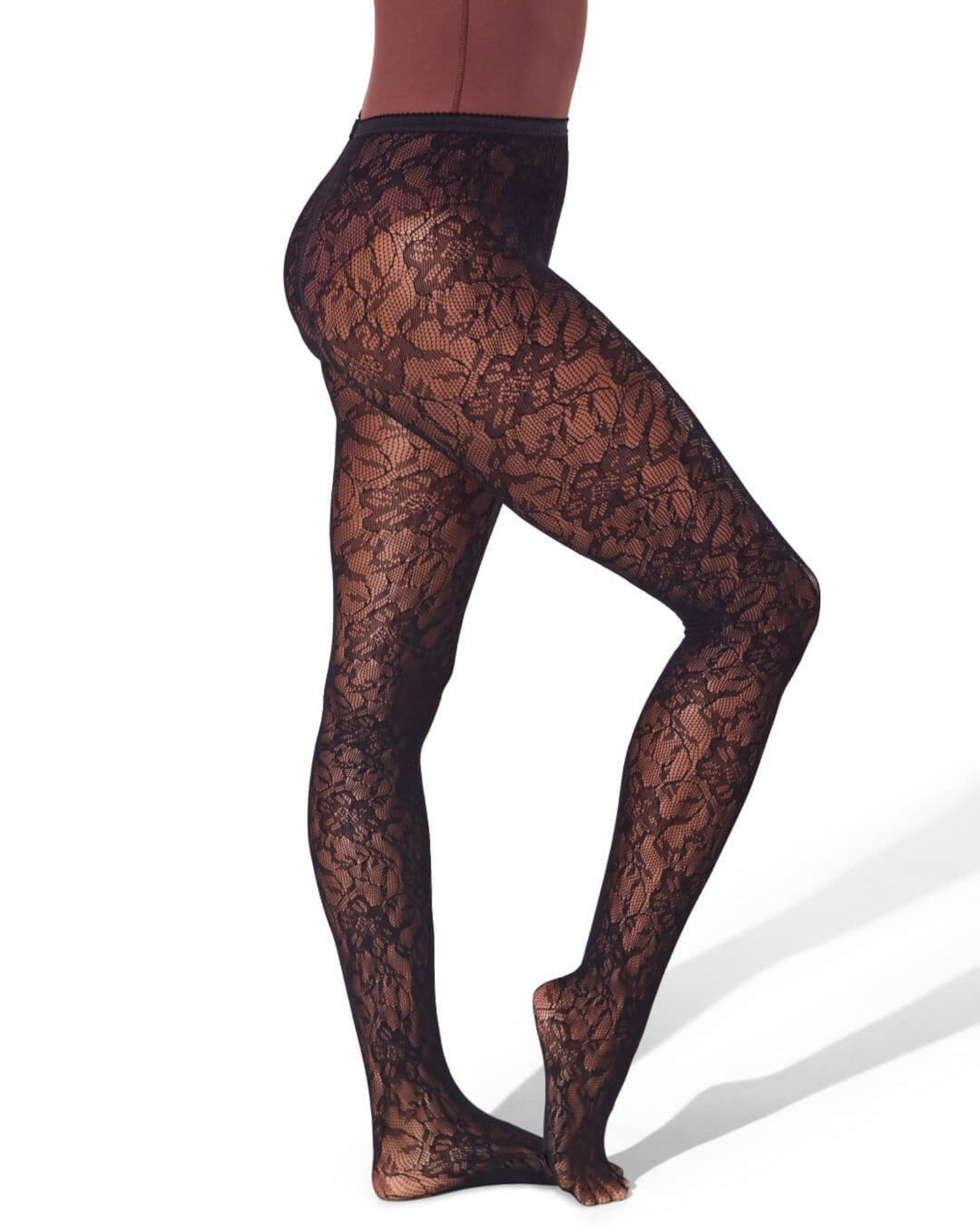 Black lace tights worn by a person on a white background