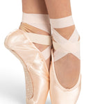 Ballet shoes with ribbons on a white background