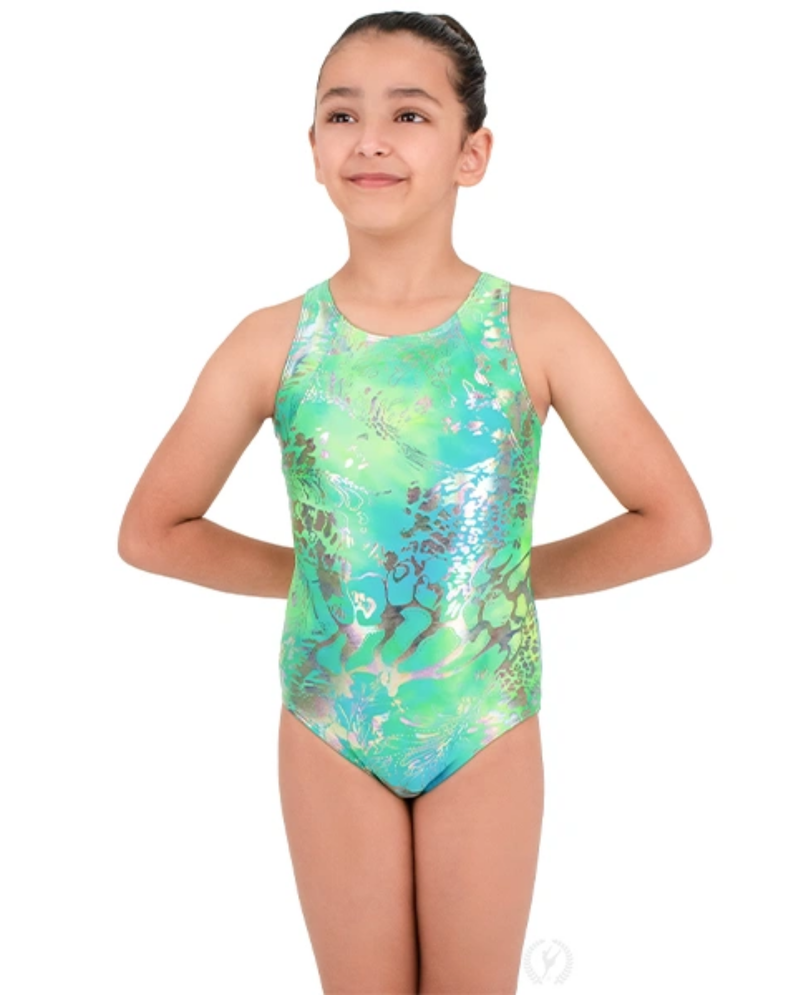 A young girl modeling a sleeveless one-piece gymnastics leotard with a green and blue abstract pattern, set against a plain white background.