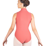 Person wearing a coral leotard and pink tights on a white background