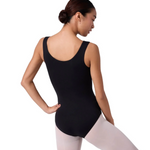 Person wearing a black leotard and white tights on a white background