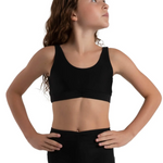 Woman wearing a black bra top and shorts on a white background