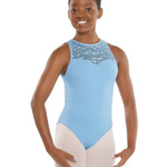A young girl dancer wearing a light blue sleeveless leotard with a textured lace yoke and light pink tights, posing against a solid white background.