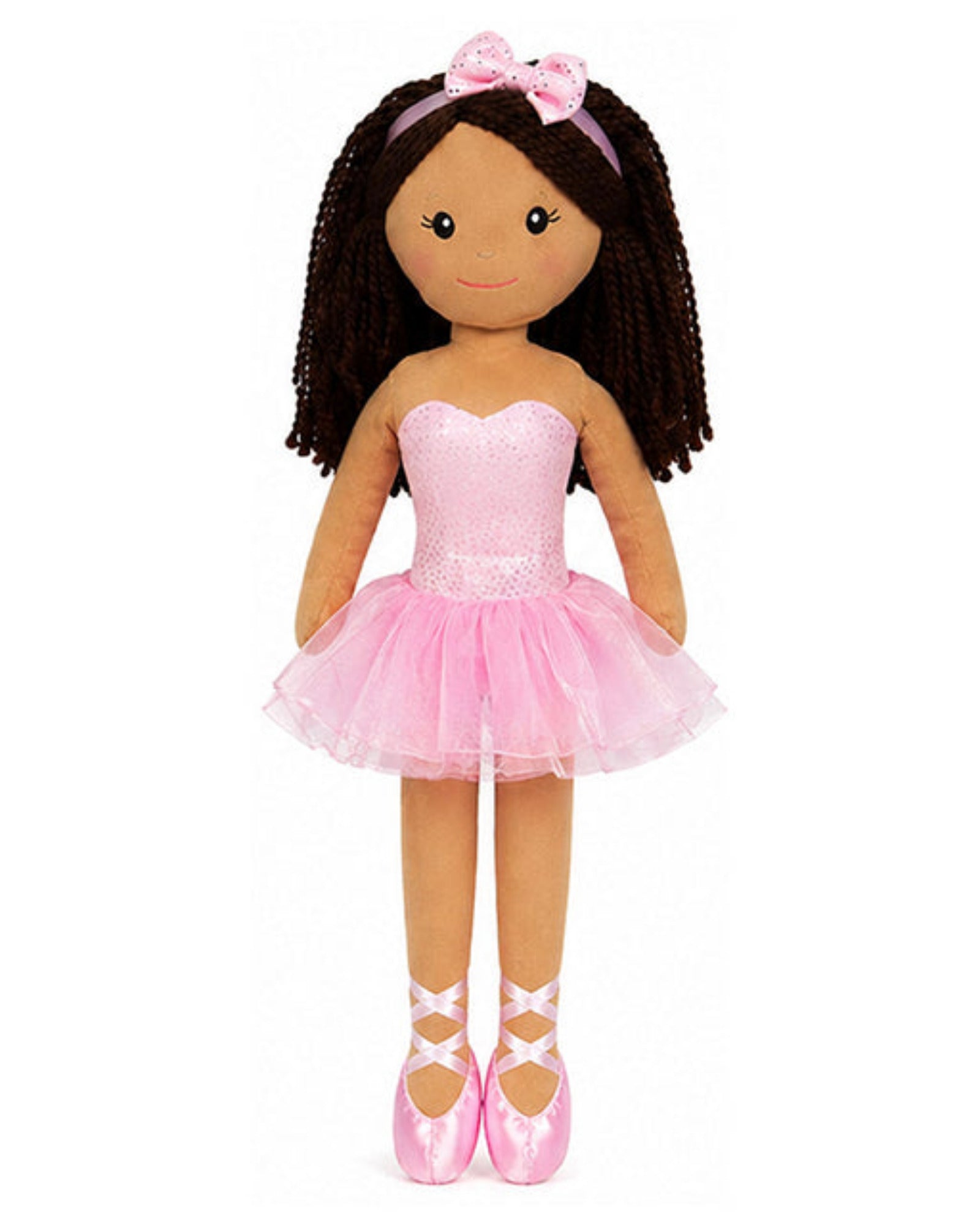 Doll in a pink ballet outfit with a tutu on a white background